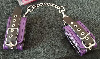 The cuffs are a striking purple and black