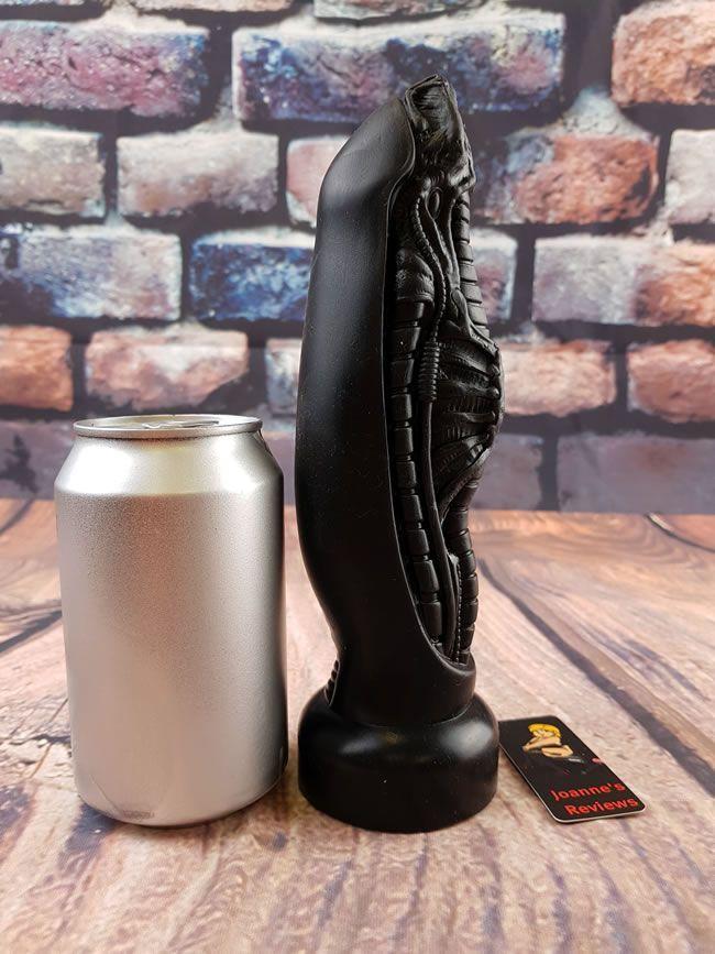 Image showing the dildo next to a pop can for scale