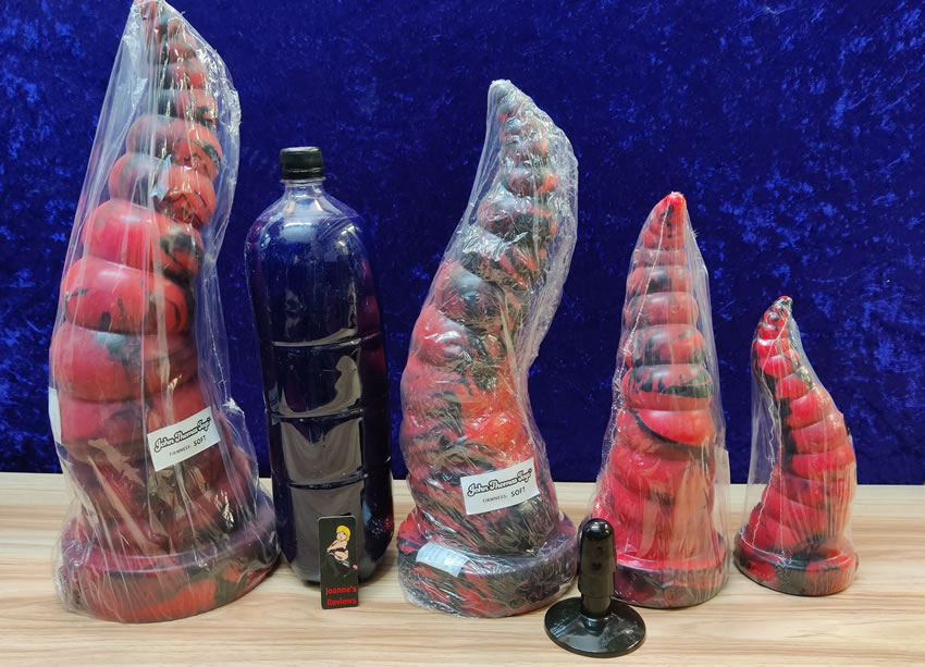 Image showing all four sizes of the Horny stretcher with a 2l soft drinks bottle for scale