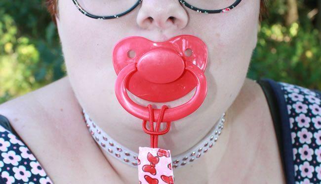 Image showing Little Rae with her red pacifier