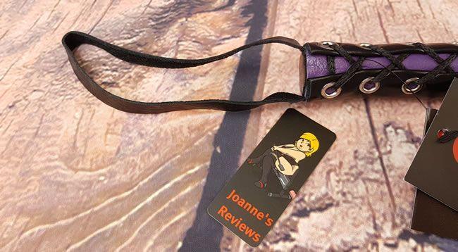 Image showing the loop of leather on the handle of the cat o nine tails