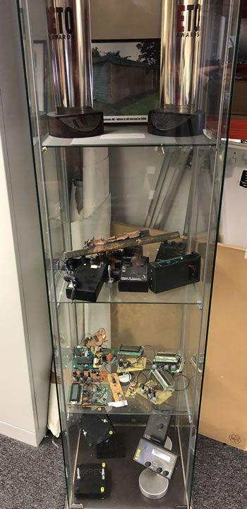 Image showing some of the E-Stim Systems original prototypes and their garden shed