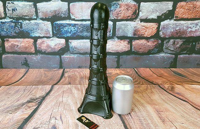 Picture showing the Eiffel Tower Dildo removed from its wrapping and next to a coke can for size comparison