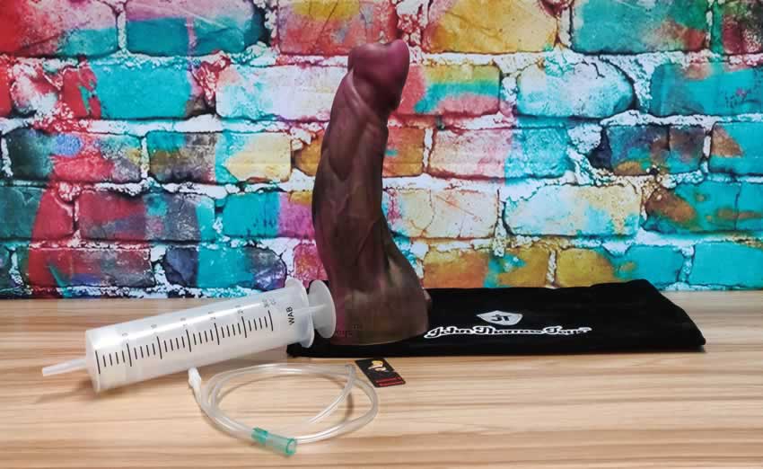 Image showing the Sampson dildo, its cumtube and syringe together with its storage bag