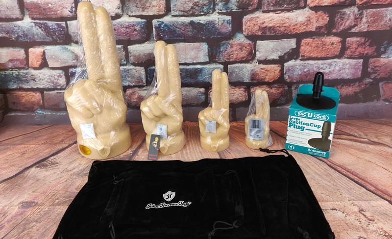 All four of The Extremity dildo's and their storage bags with the free Vac-u-lock suction cup