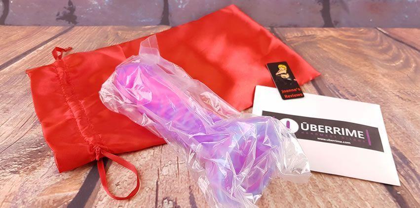 Image showing the Uberrime Helios Sun God Dildo in its sealed pouch and the storage bag