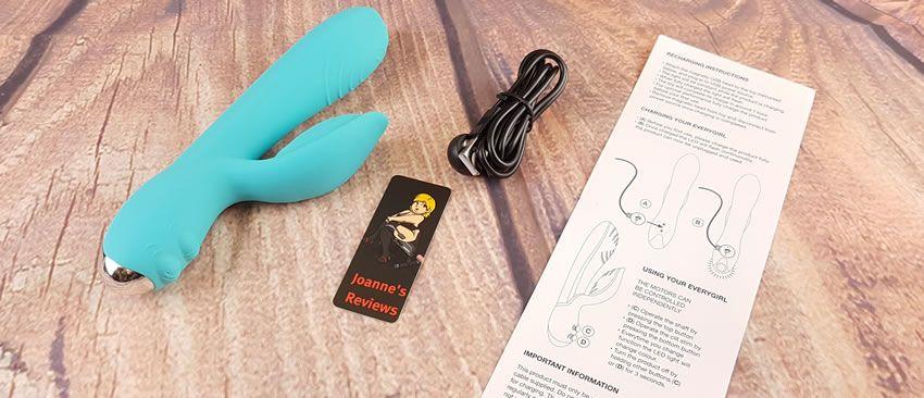 Image showing the Everygirl vibrator with its charging cable and instructions